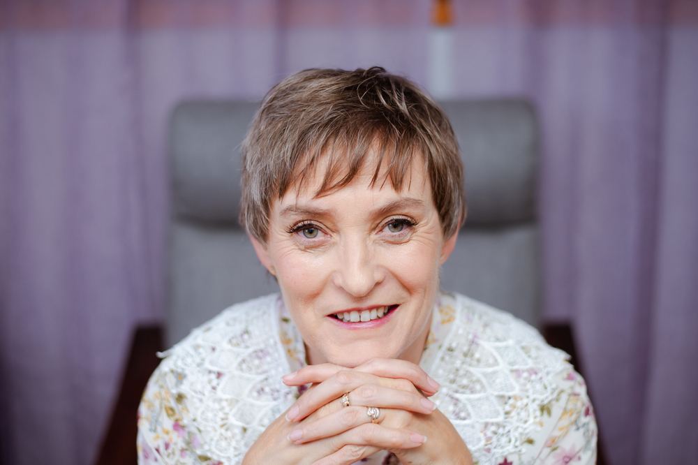 Ronel working on a wedding gown